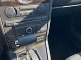 the interior of a car with a steering control and dashboard controls