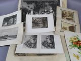 a lot of old photographs on the table