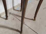 an image of a table with a marble top and brass legs