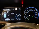 the dashboard of a car with a speedometer, gauge, and other electronic devices