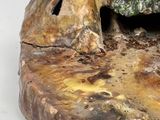 a close up of a piece of wood with a hole in it