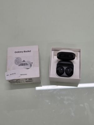 a box with a pair of black earphones in it