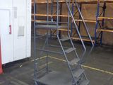 an image of a room with a lot of shelves and ladders
