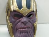 thanos mask sitting on a white surface with a white background