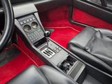 a car dashboard with a remote control and a steering wheel