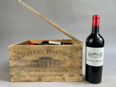 a wooden box with a bottle of wine inside of it