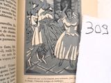 un livre ouvert sur lequel est représentée une femme et un chien