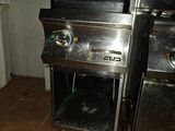 a picture of a kitchen with a stove and a sink