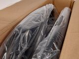 two rolls of plastic wrap sitting in a cardboard box