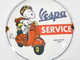 an old vespa service sign is displayed on a white wall