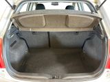the back of a car with the trunk open and the seats down