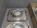 two silver trays and a mirror in a box