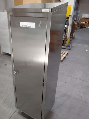 a stainless steel cabinet in the middle of a warehouse