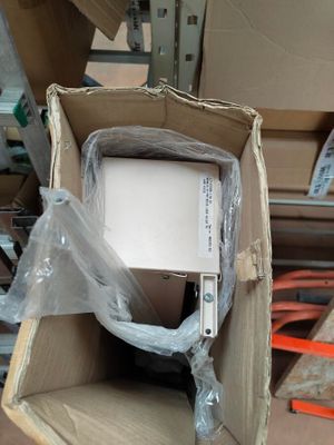 a box with a computer inside of it on the floor