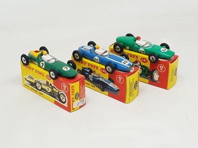 three toy cars that are sitting on top of each other