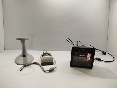 a picture of a table with a lamp and a picture frame on it