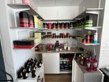 a room with a lot of bottles and shelves on the wall