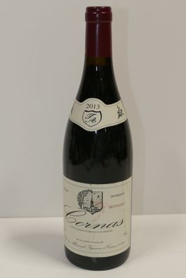 a bottle of wine that is sitting on a table