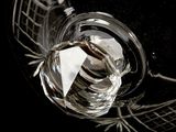 a glass with a paper boat inside of it