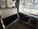 an image of a commercial kitchen with stainless steel appliances