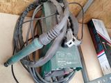 a lot of wires and tools on the floor