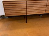 an image of a wooden sideboard in a store
