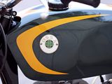 a green and yellow motorcycle parked on the street
