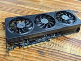 a close up of a video card sitting on top of a wooden table