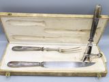 two knives and a fork in a case