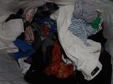 an image of a pile of clothes on a bed