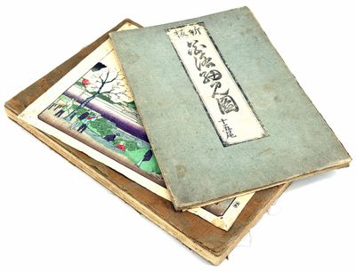 three books are stacked on top of each other on a white surface
