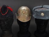 three hats are lined up on a mannequin head on a black background