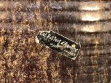 a close up of a metal container with a sticker on it