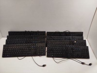 a lot of keyboards that are sitting on a table