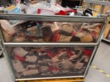 a metal cart filled with assorted items in a warehouse