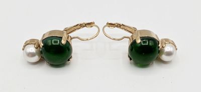 a pair of green and white pearls and gold earrings