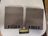 two metal boxes that are sitting on top of a table