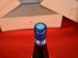 a bottle of wine that is sitting on a table