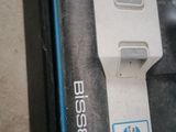 a laptop computer sitting on the floor with its lid open
