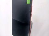 a cell phone that is sitting on top of a stand