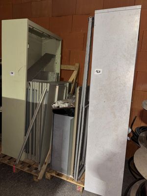 a refrigerator and a refrigerator freezer in a room