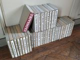 books stacked on top of each other on a wooden floor
