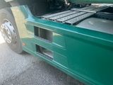 a green bus with a keyboard on the back of it
