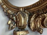 a mirror that is sitting on the wall next to a mirror