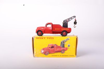 a red toy truck with a crane on top of it