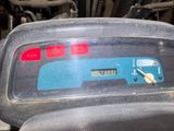 a close up of a car ' s dashboard with a clock on it