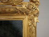 a gold frame with a picture of a woman on it