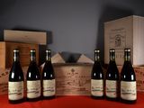 several bottles of wine are lined up on a table