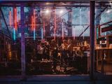 a group of people that are playing music in a store window