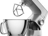 an image of a silver mixer with a metal bowl on top of it